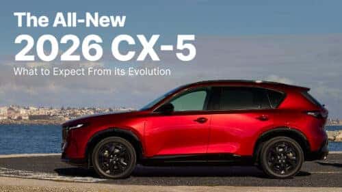 red 2026 mazda cx-5 sits on pier, staring at the sea longingly