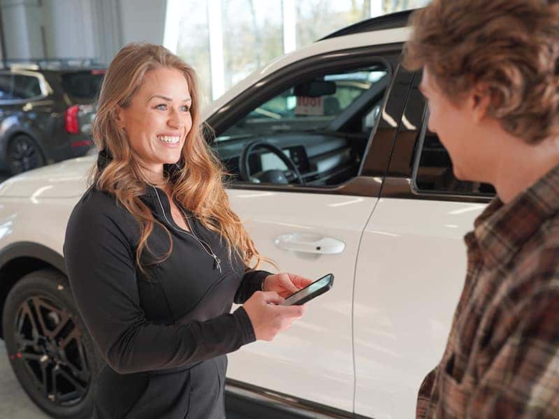 Service advisor reviewing service details with a customer during a maintenance appointment