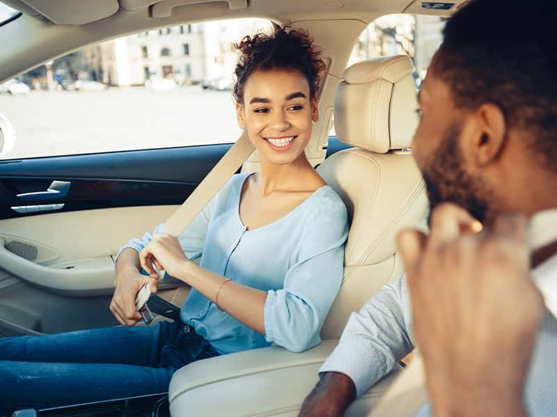 A couple leasing their first car