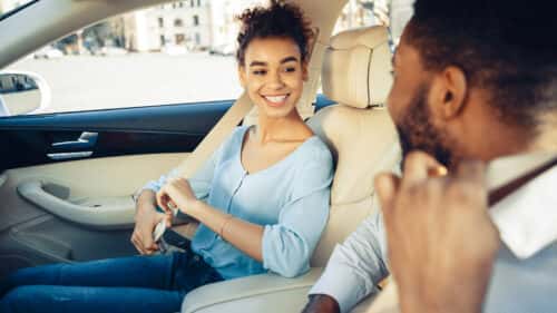 A couple leasing their first car