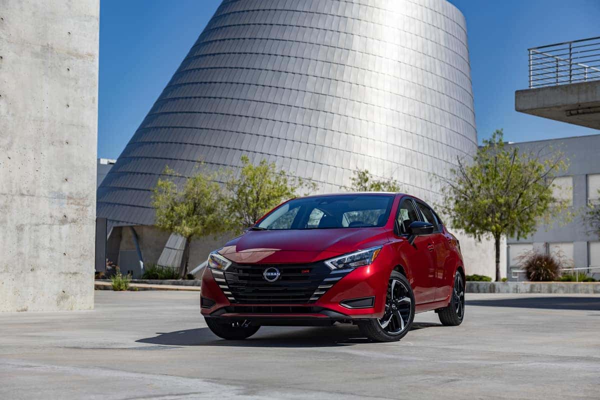 Red 2024 Nissan Versa parked