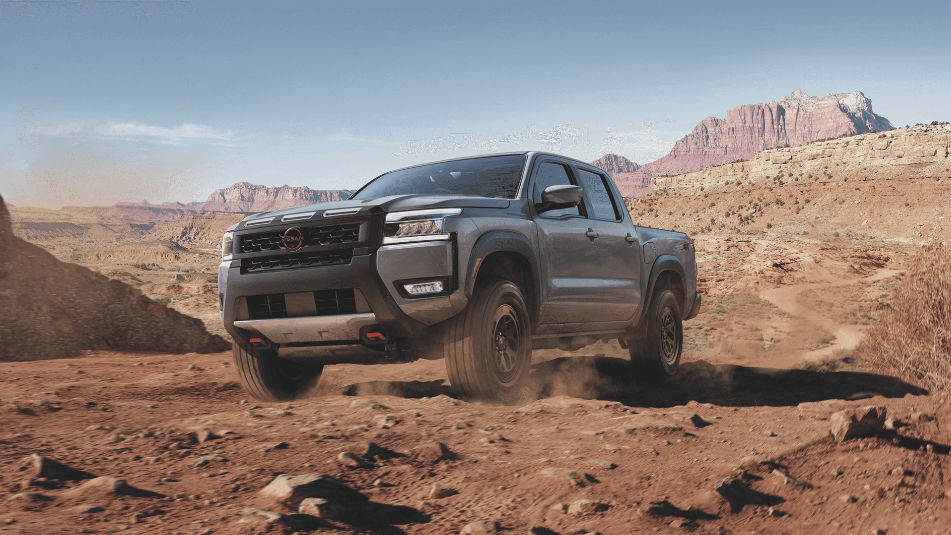 Grey 2025 Nissan Frontier showcasing its rugged design.