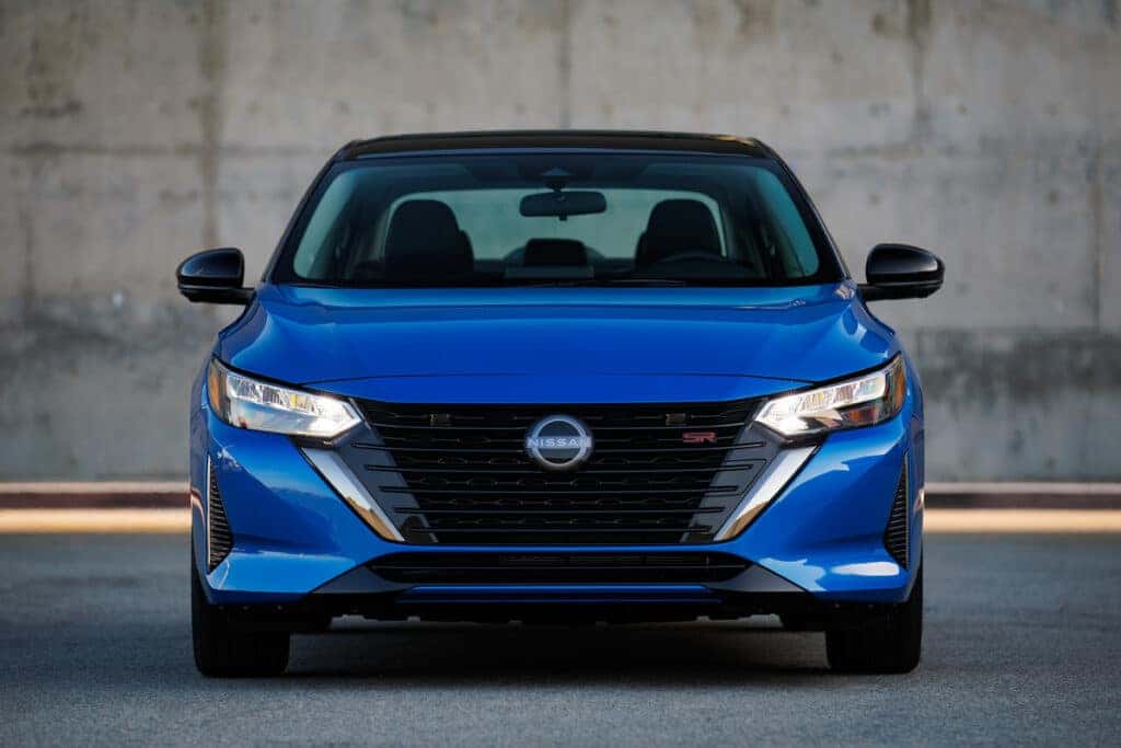 Front end and grille of a blue 2025 Nissan Sentra