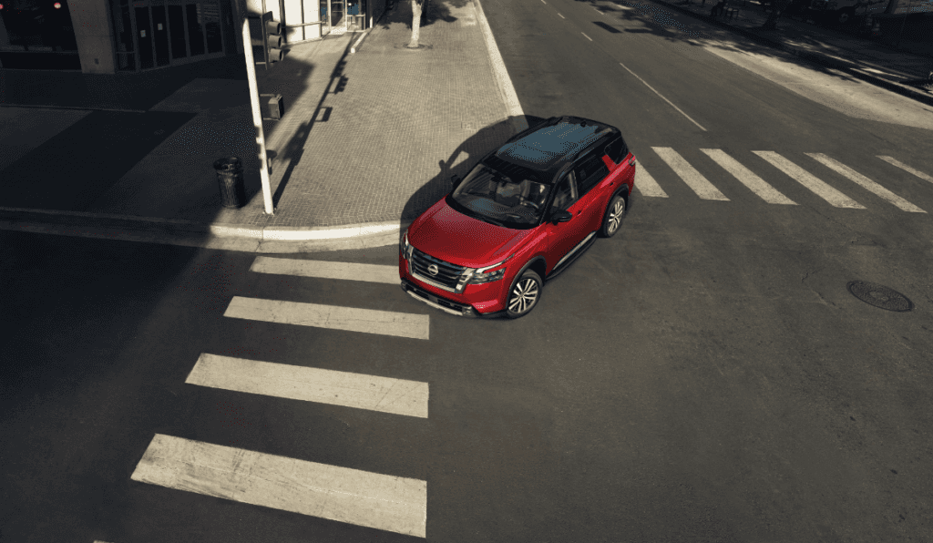 2024 Nissan Pathfinder turning on a city street