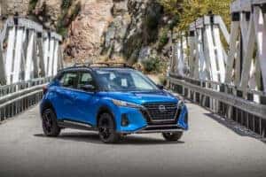 2024 Blue Nissan Kicks parked on a bridge