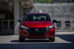 Front grille of a red 2024 Nissan Versa