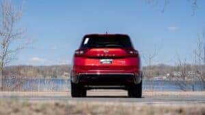Red 2024 Nissan Rogue back end overlooking a lake
