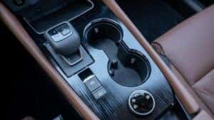 Interior gear shift and cup holders on a 2024 Nissan Rogue