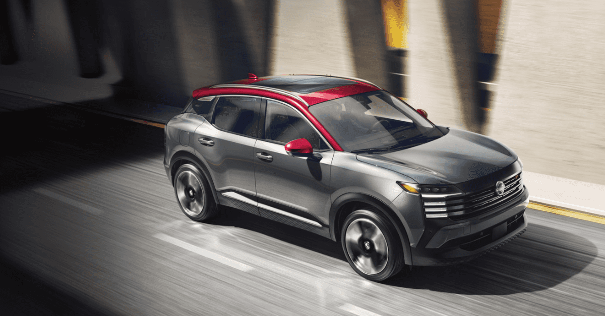 grey and red 2025 nissan kicks driving