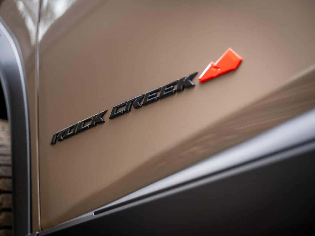 2025 Nissan Rogue Rock Creek black exterior badging