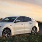 white Maserati-MY19-Levante-GTS-V8 parked in meadow at sunset